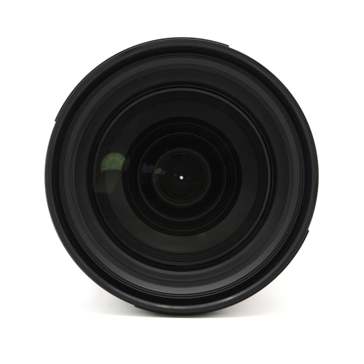 Black camera lens on a white background