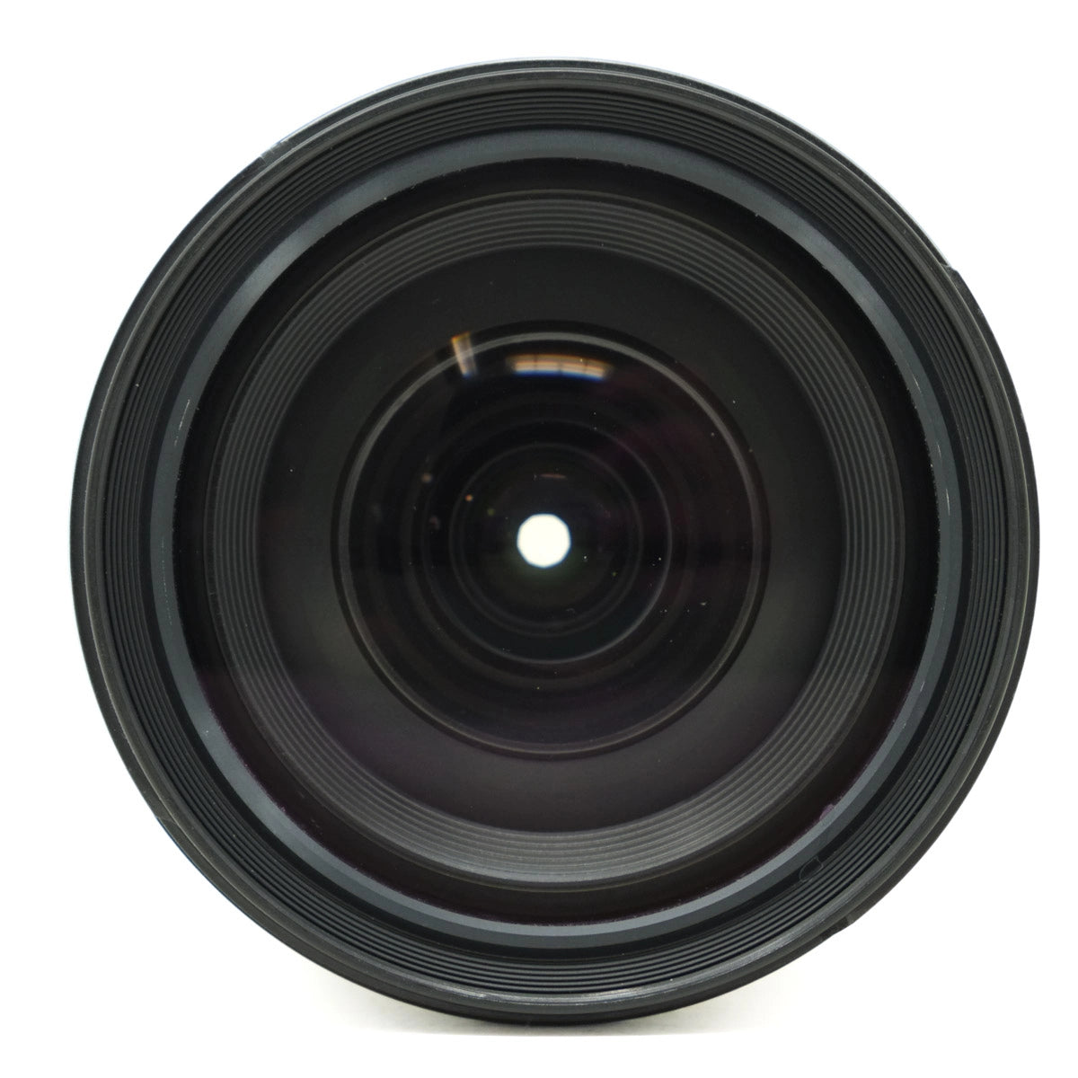 Black camera lens on a white background
