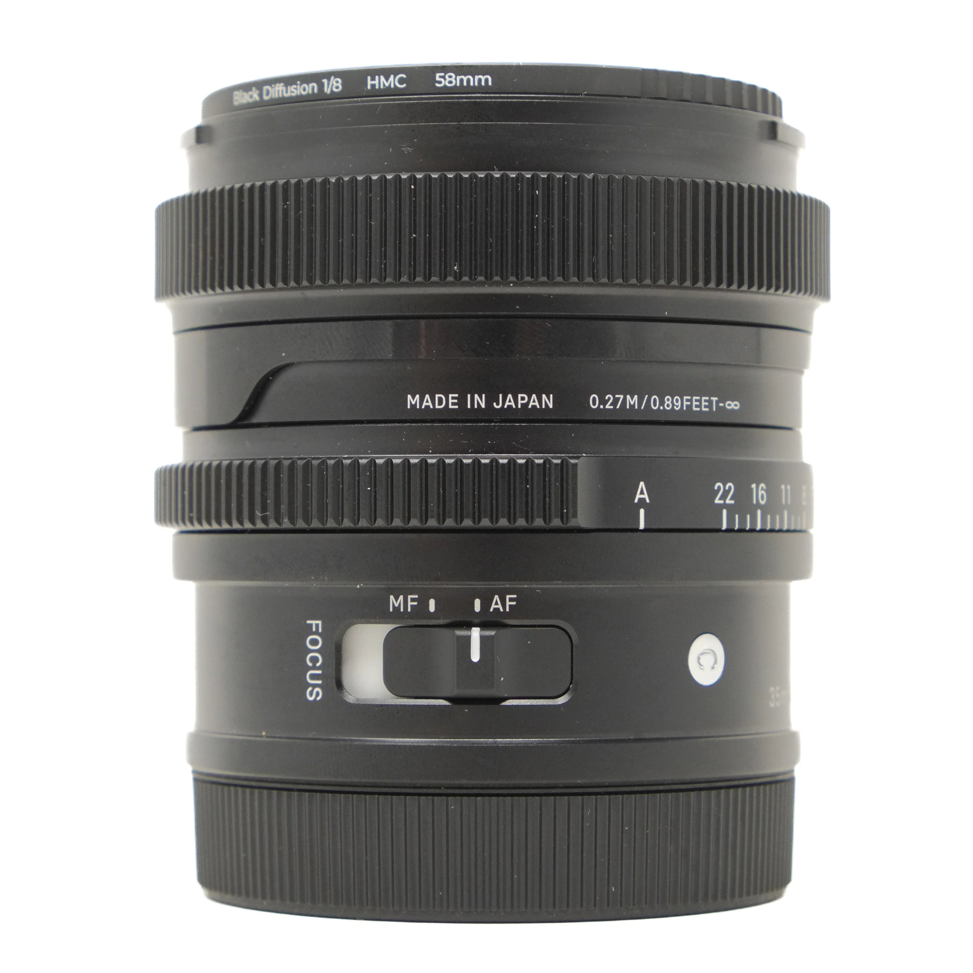 Camera lens with focus and aperture controls on a white background