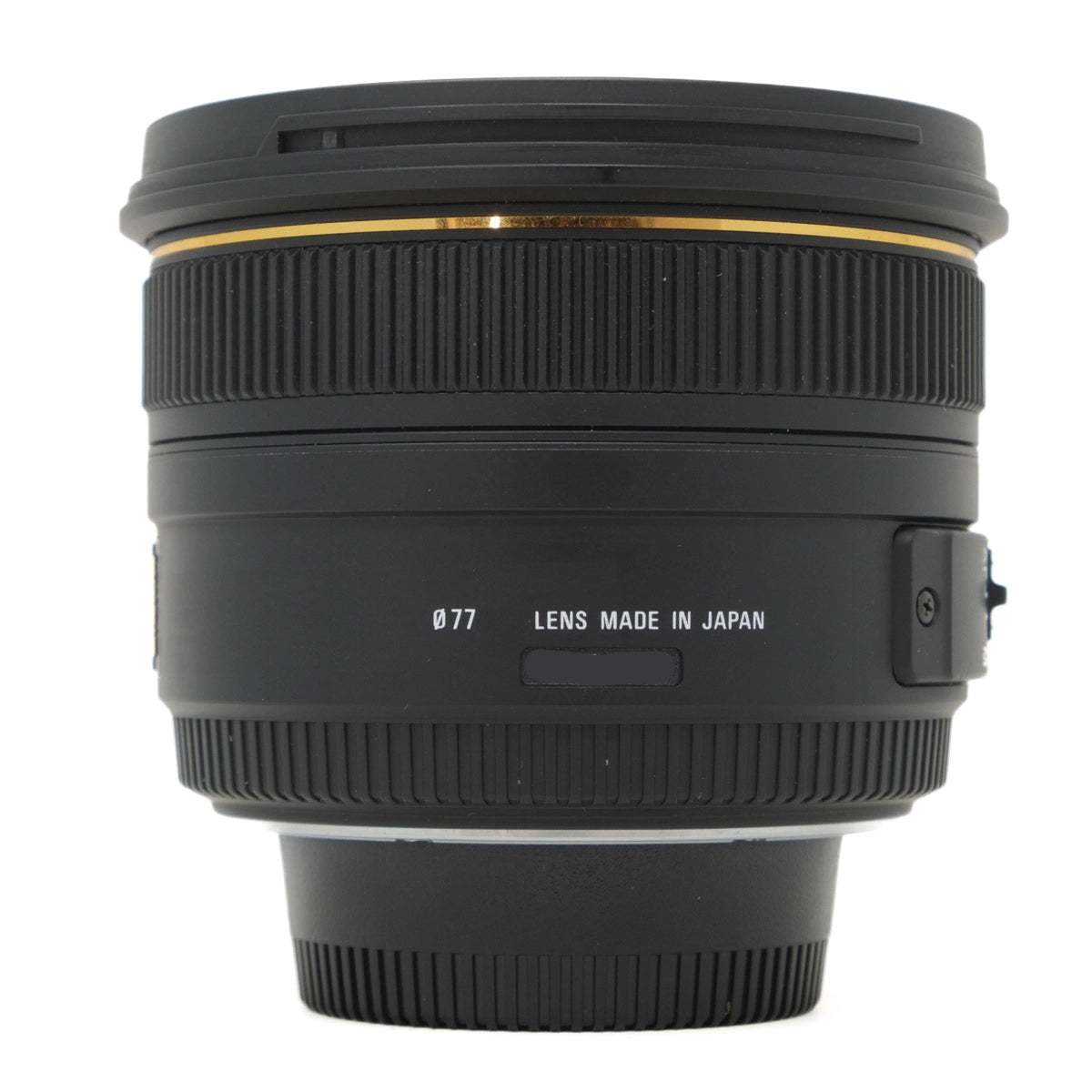 Camera lens with 'Lens Made in Japan' text on a white background