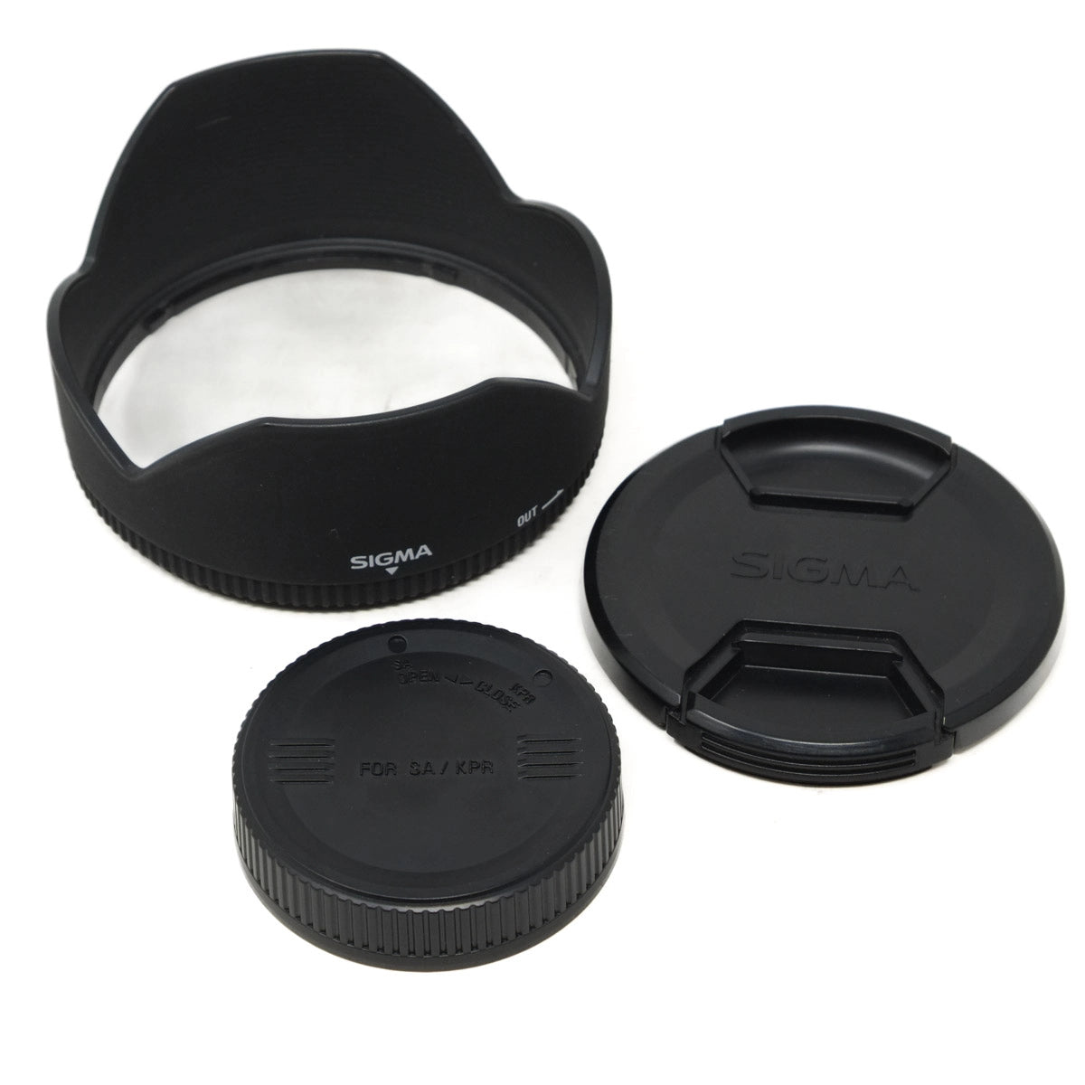 Sigma lens hood and caps on a white background
