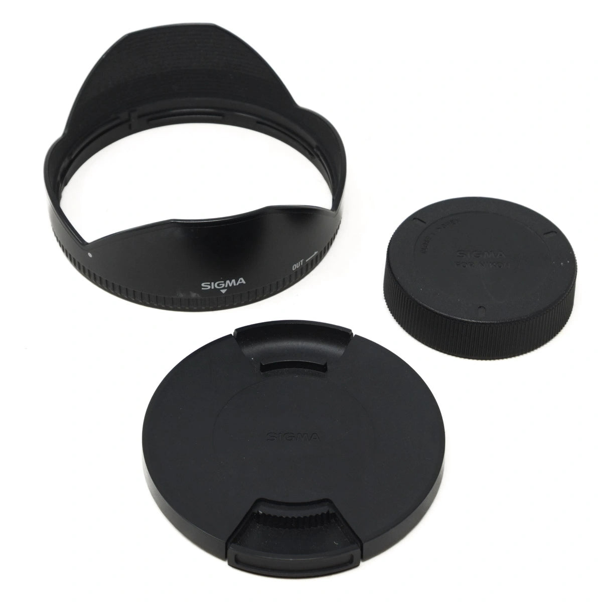 Sigma lens hood and lens caps on a white background