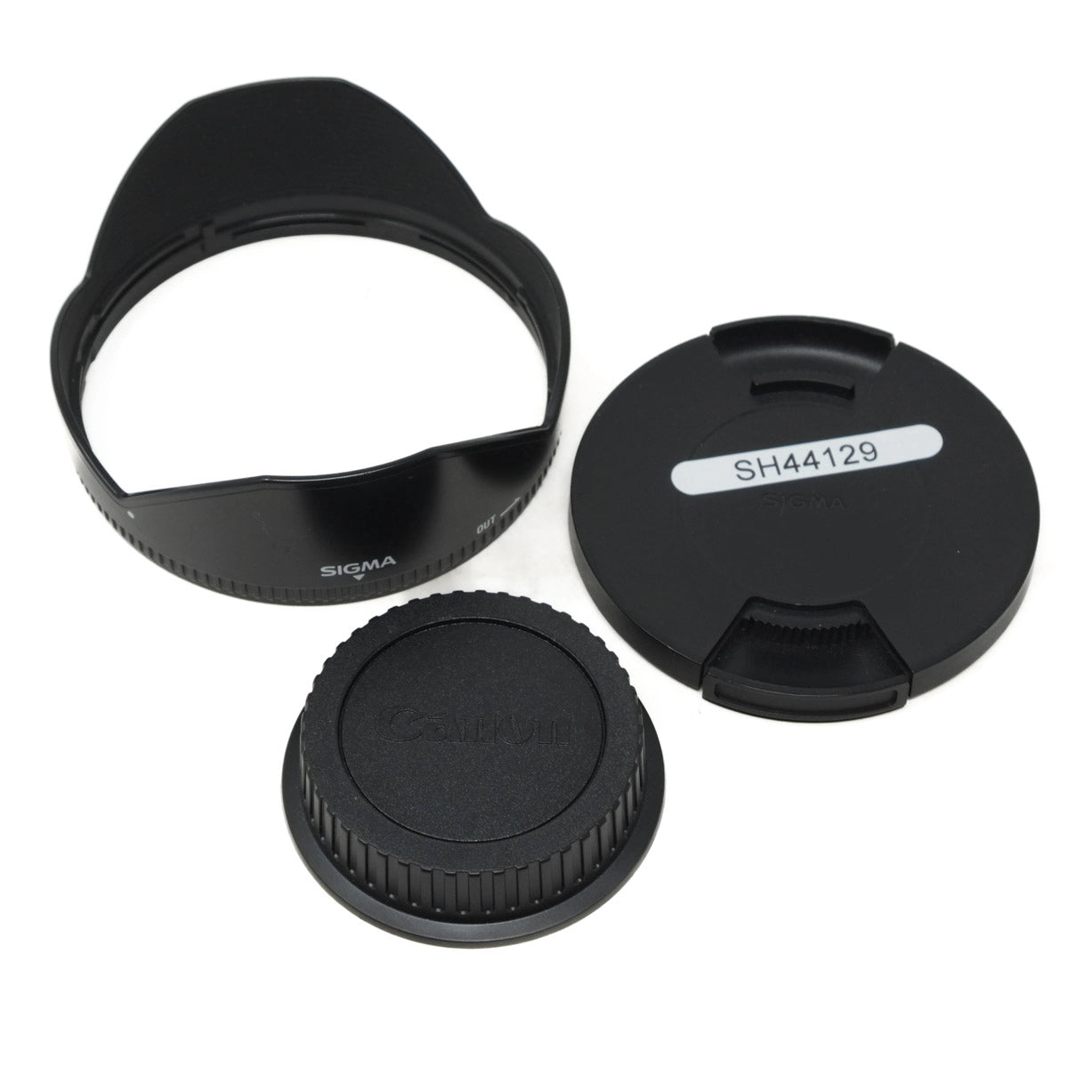 Camera lens caps and hood on a white background