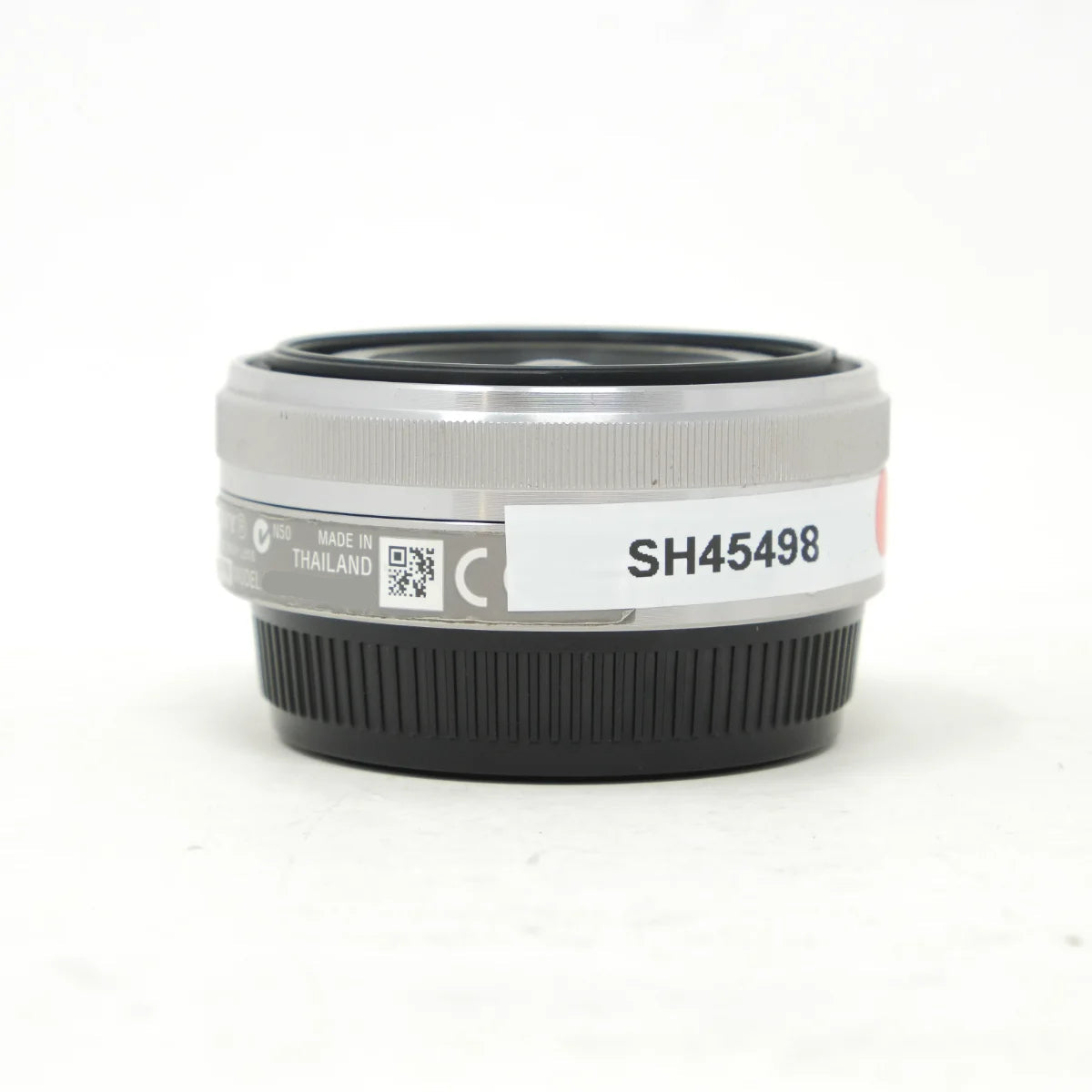 Used Sony 16mm F2.8 Pancake Lens in Silver E Mount - side angle 