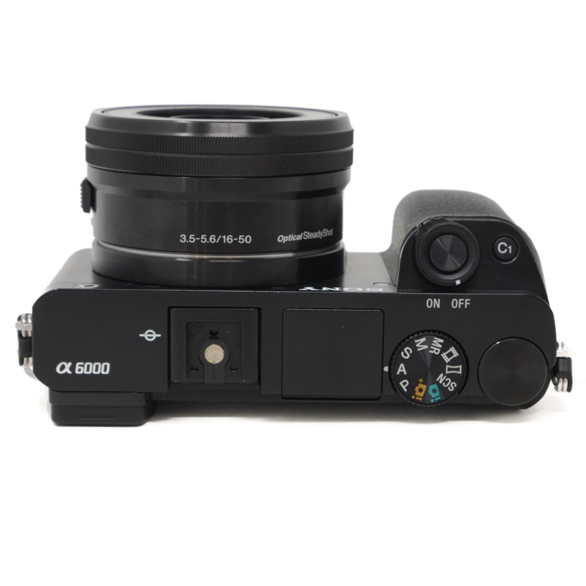 Black camera body with lens on a white background