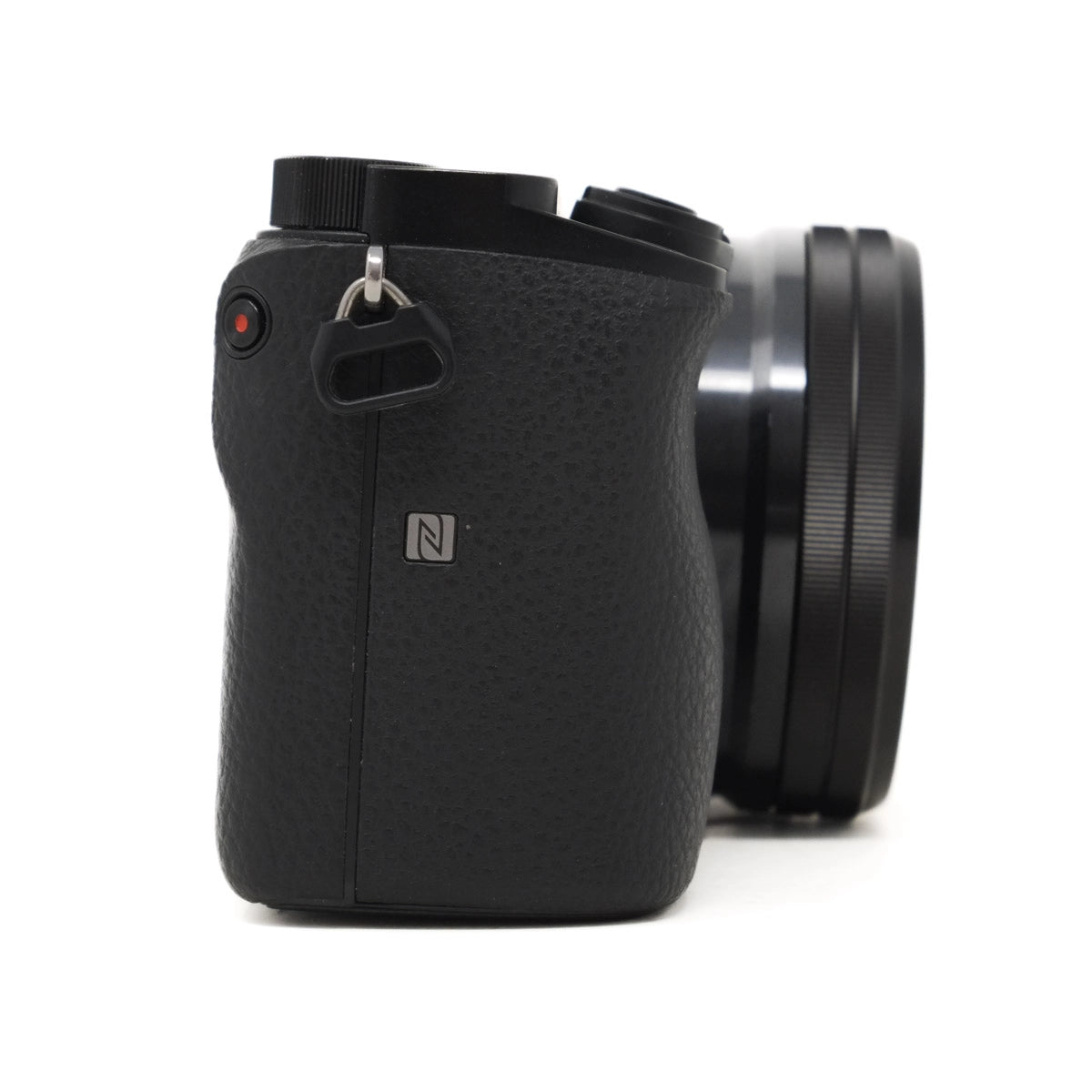 Black camera with a textured finish on a white background