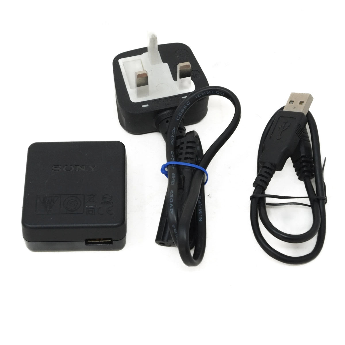 Sony charger set with plug, cable, and adapter on a white background