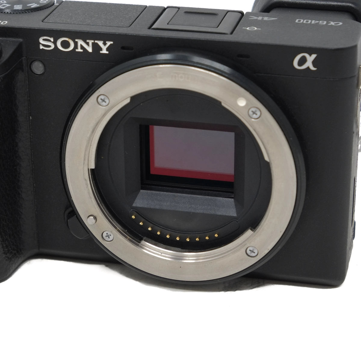 Sony camera body without a lens on a white background