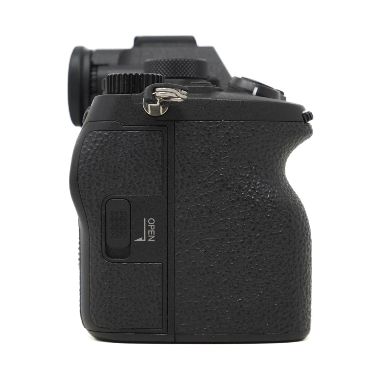 Black camera body with textured grip on a white background