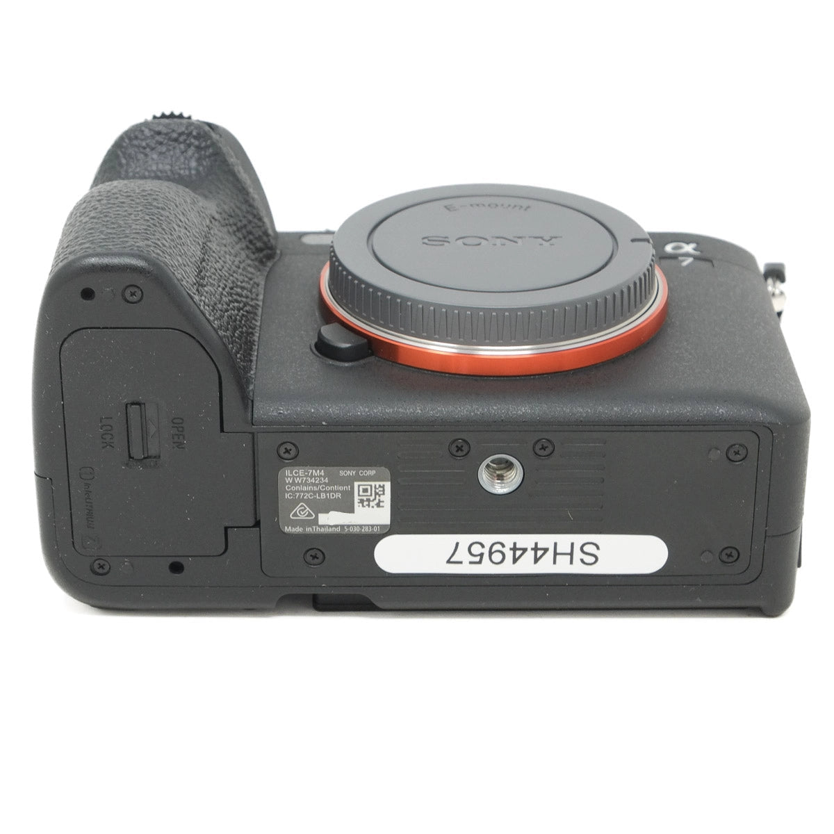 Bottom view of a Sony camera on a white background