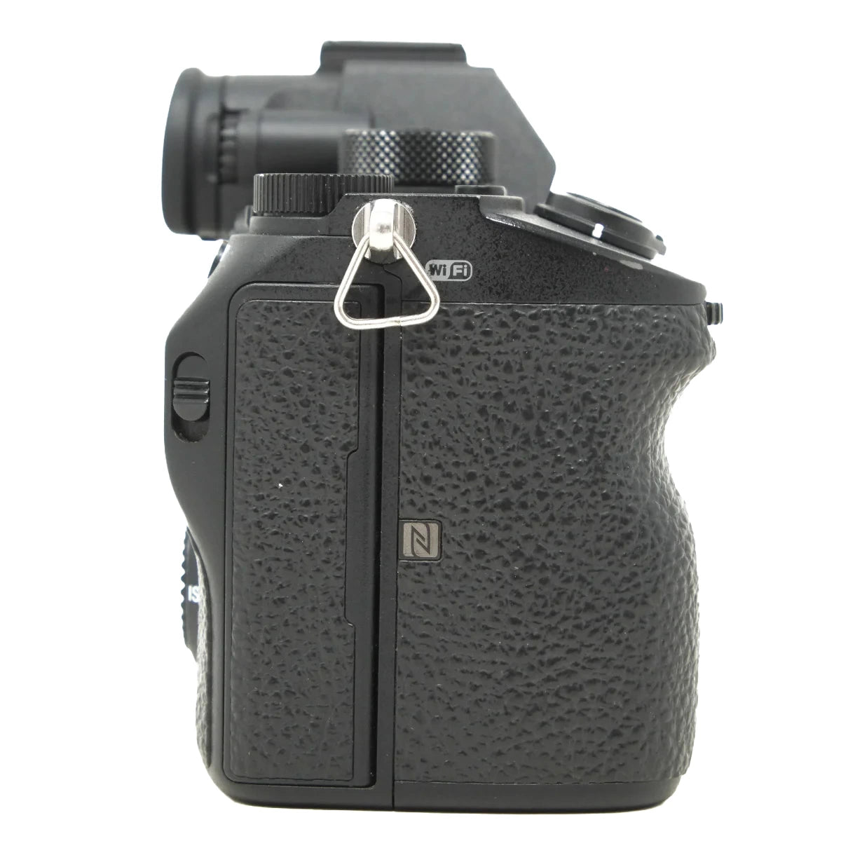 Black Sony mirrorless camera body with a textured grip, showing the top and side details including a silver metal tri-ligament mount and a small 'N' logo on a white background.