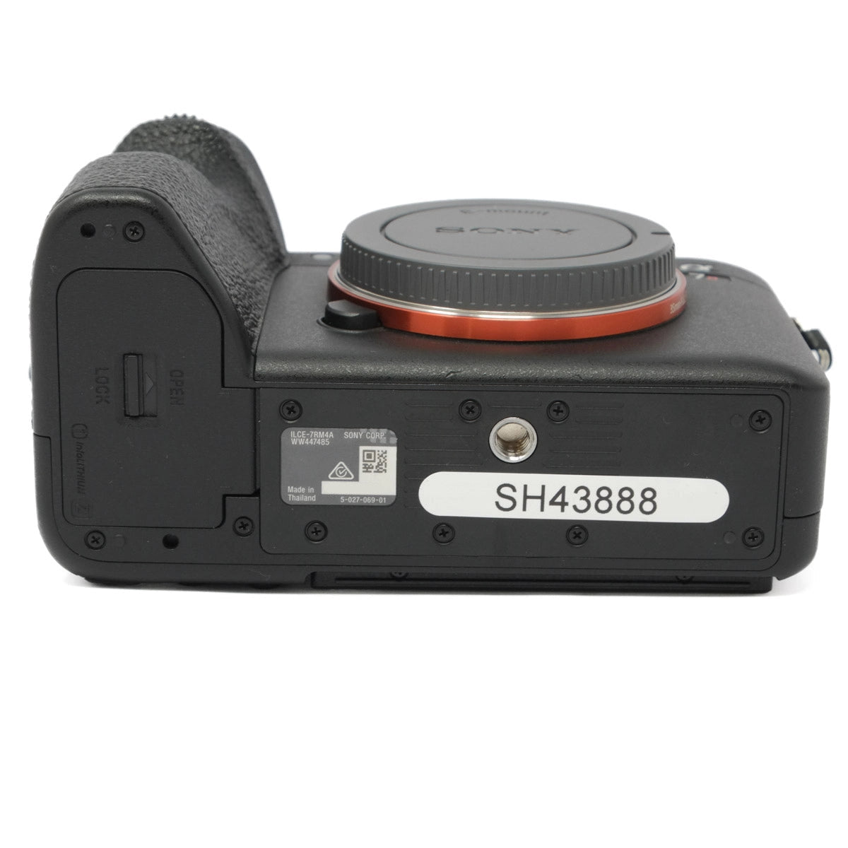 Bottom view of a camera body on a white background