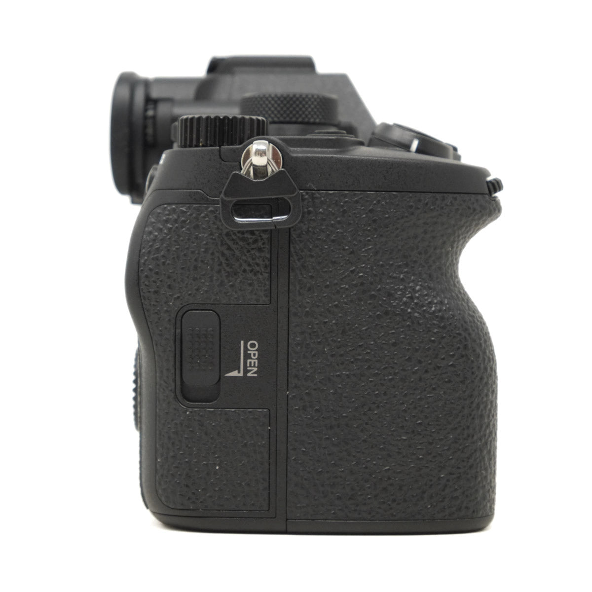 Black camera body with textured grip on a white background