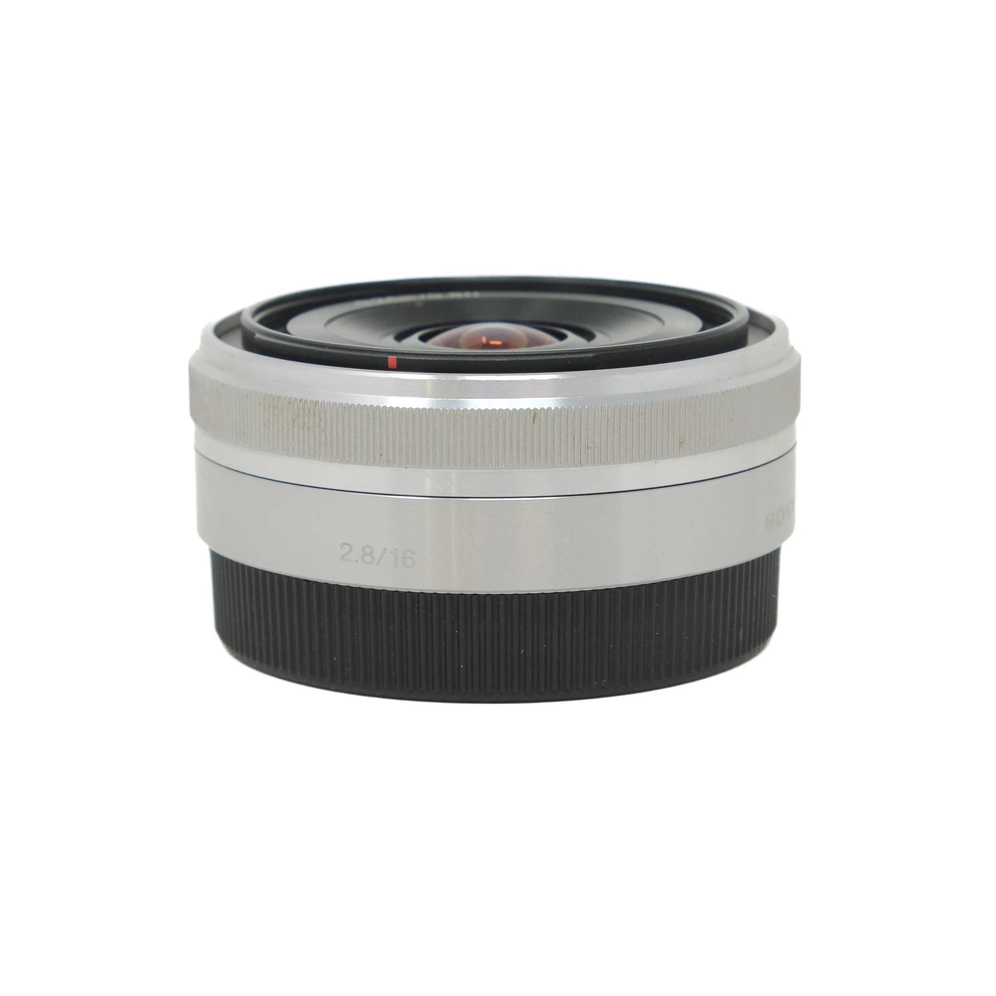 Camera lens with silver and black design on a white background