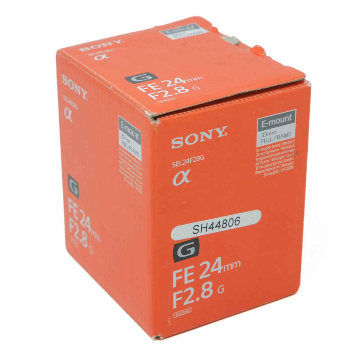 Orange Sony camera lens packaging box on a white background
