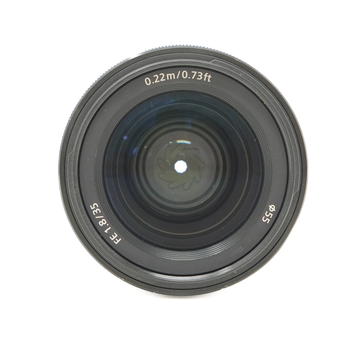 Camera lens with text on a white background