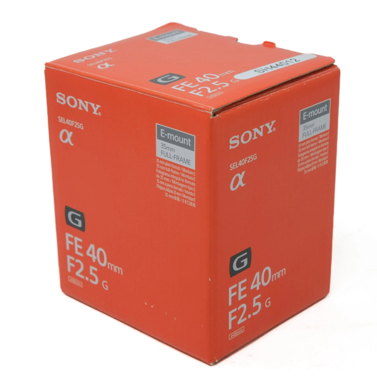 Orange Sony camera lens packaging box with model details on a white background
