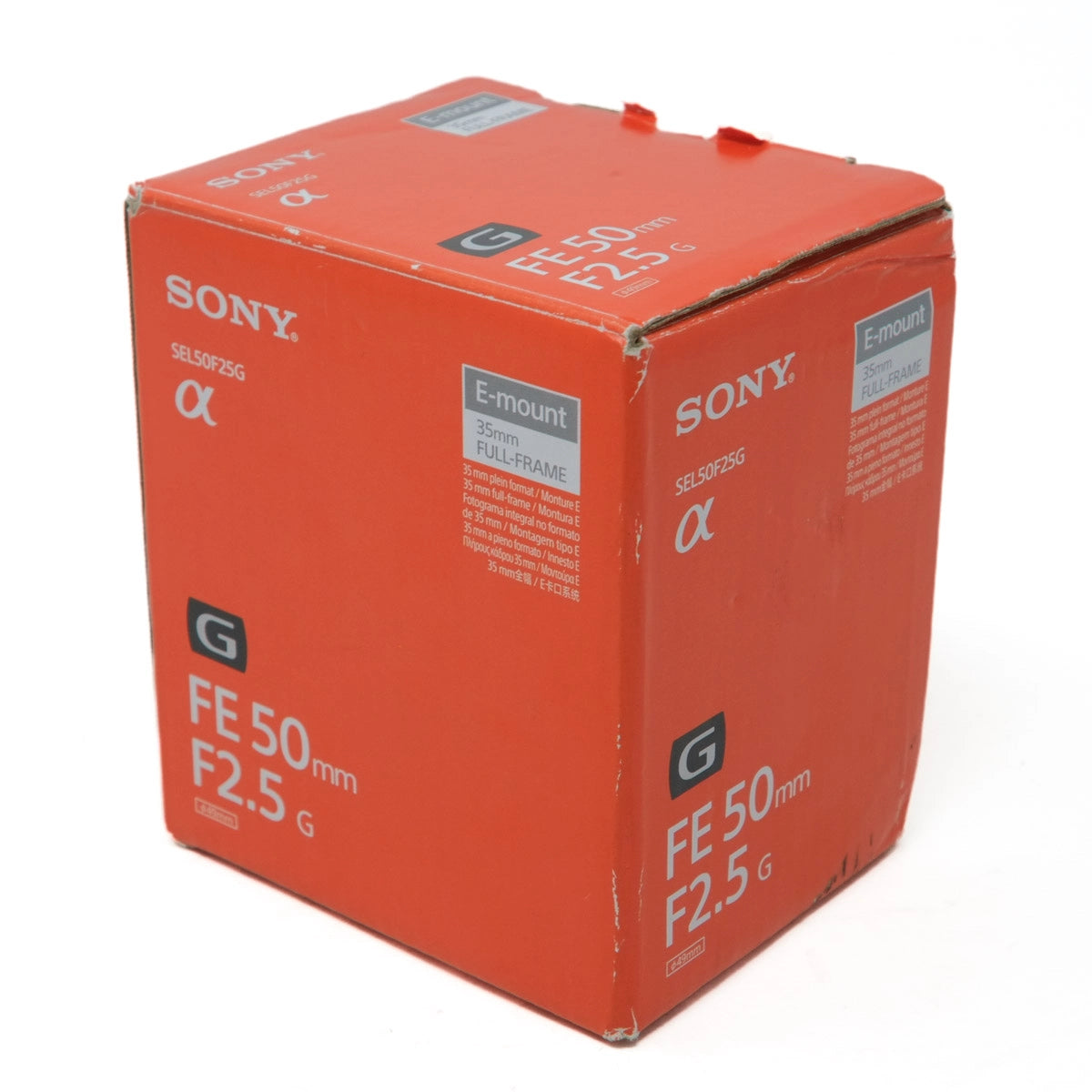 Orange Sony camera lens packaging box with 'FE 50 mm F2.5 G' text on a white background