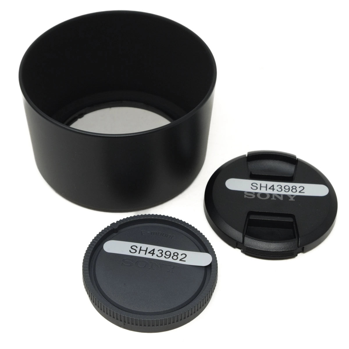 Black camera lens hood and caps with 'Sony' branding on a white background