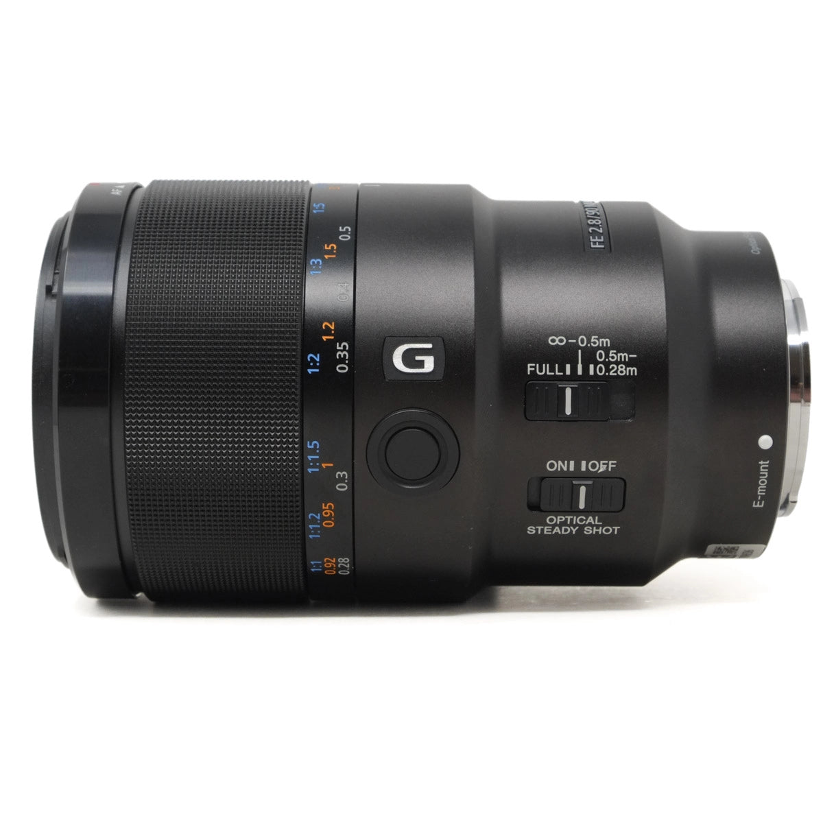 Camera lens with 'G' mark on a white background