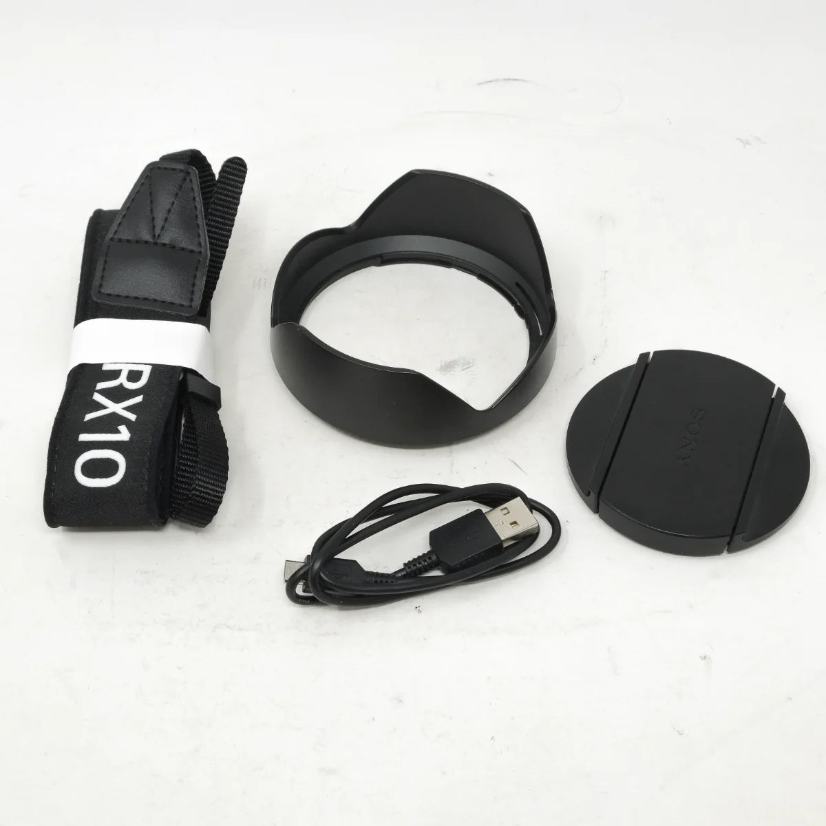 Used Sony RX10 Mark IV Bridge camera - strap, lens hood, cap and USB cable