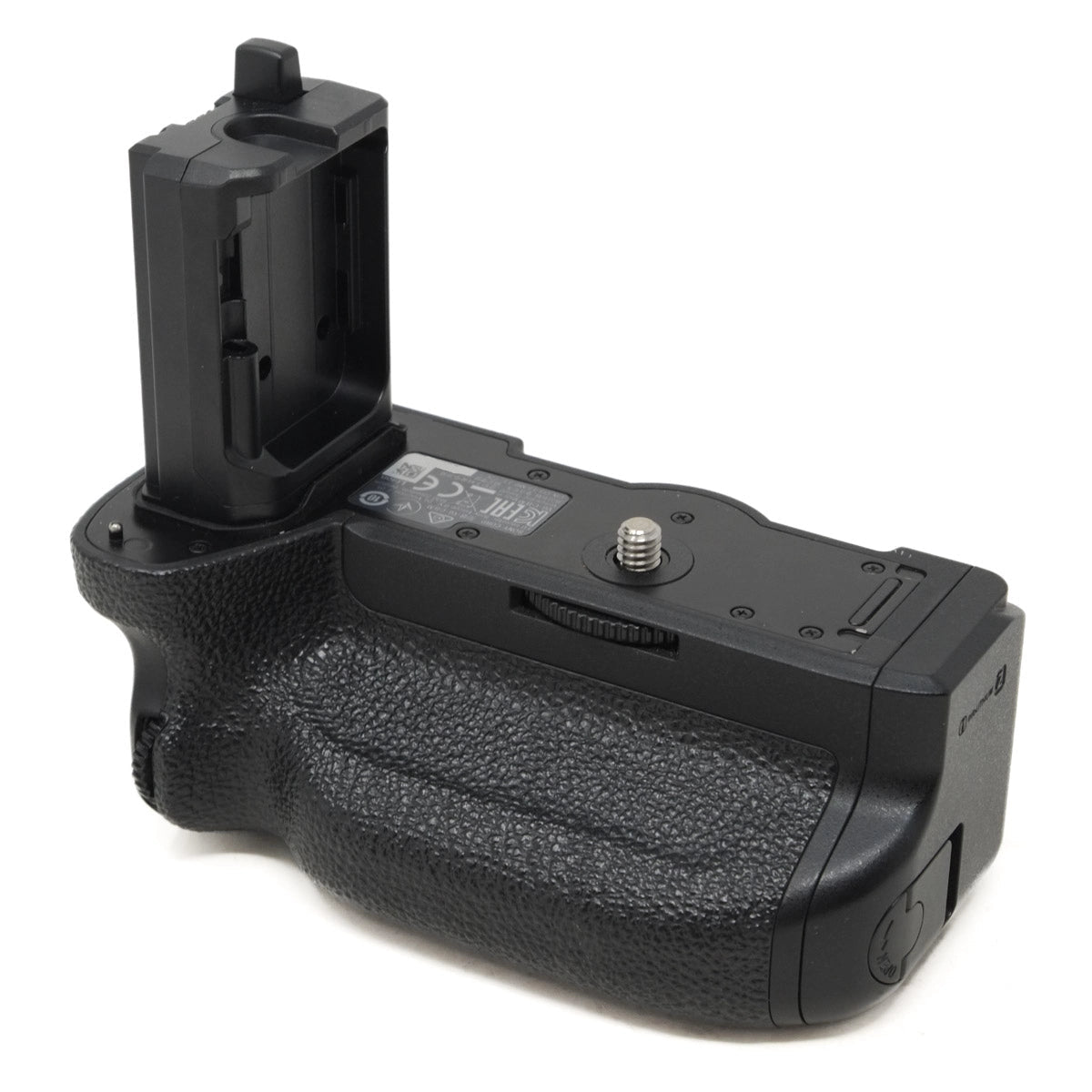 Black camera battery grip on a white background