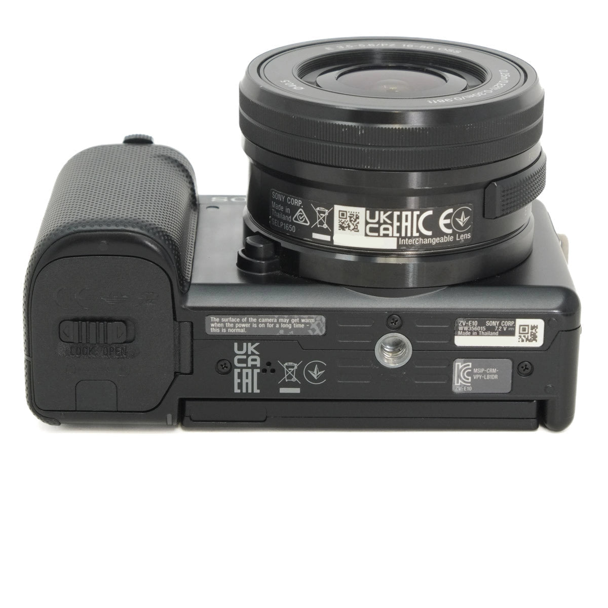 Bottom view of a black camera with lens and branding on a white background