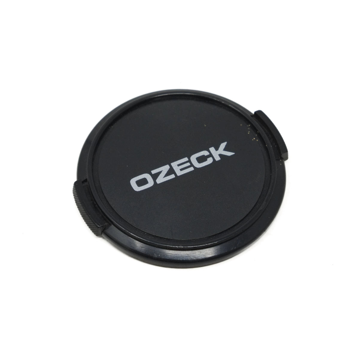 Black lens cap with 'OZECK' branding on a white background
