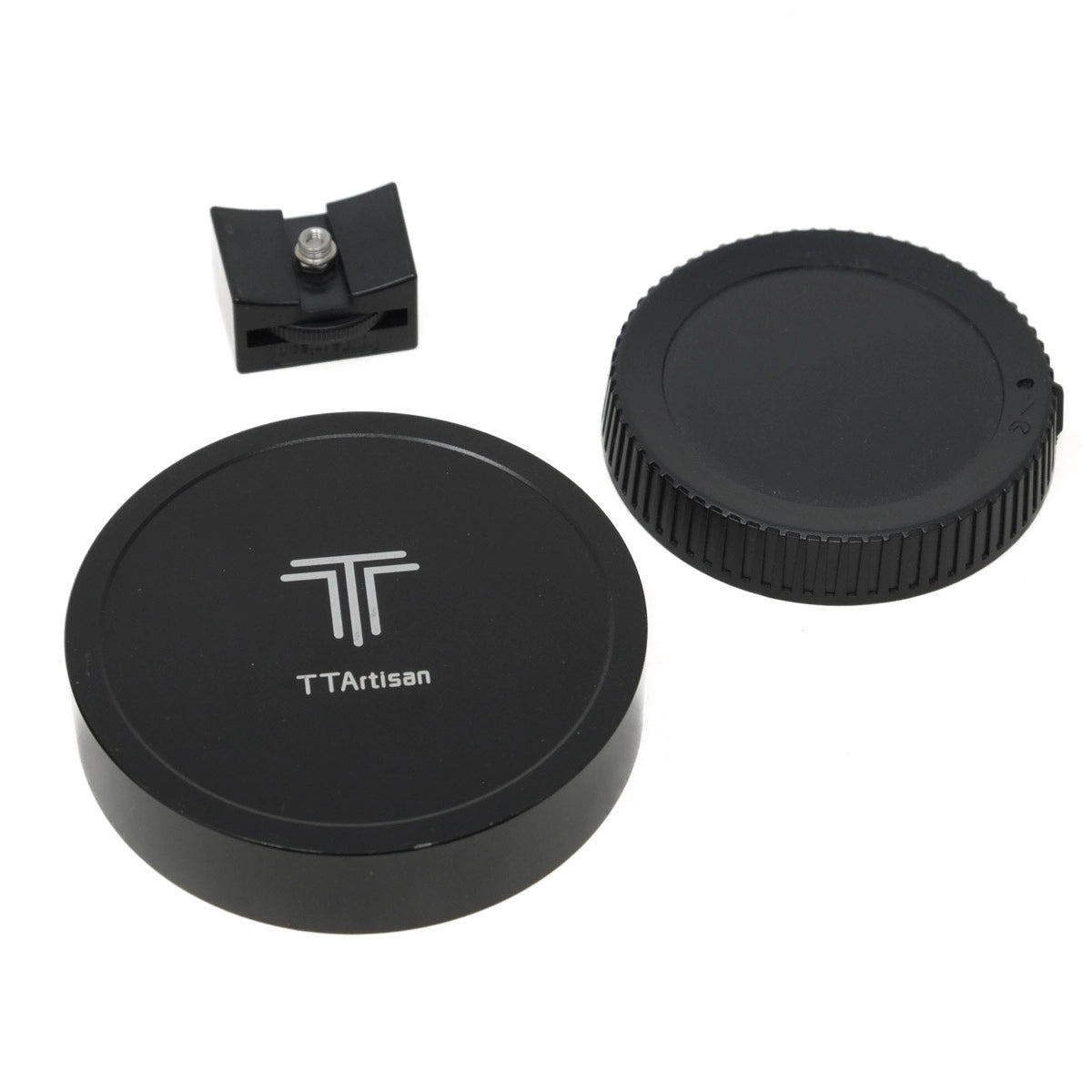 Two black camera lens caps with a small black clip on a white background, featuring the TTArtisan logo.
