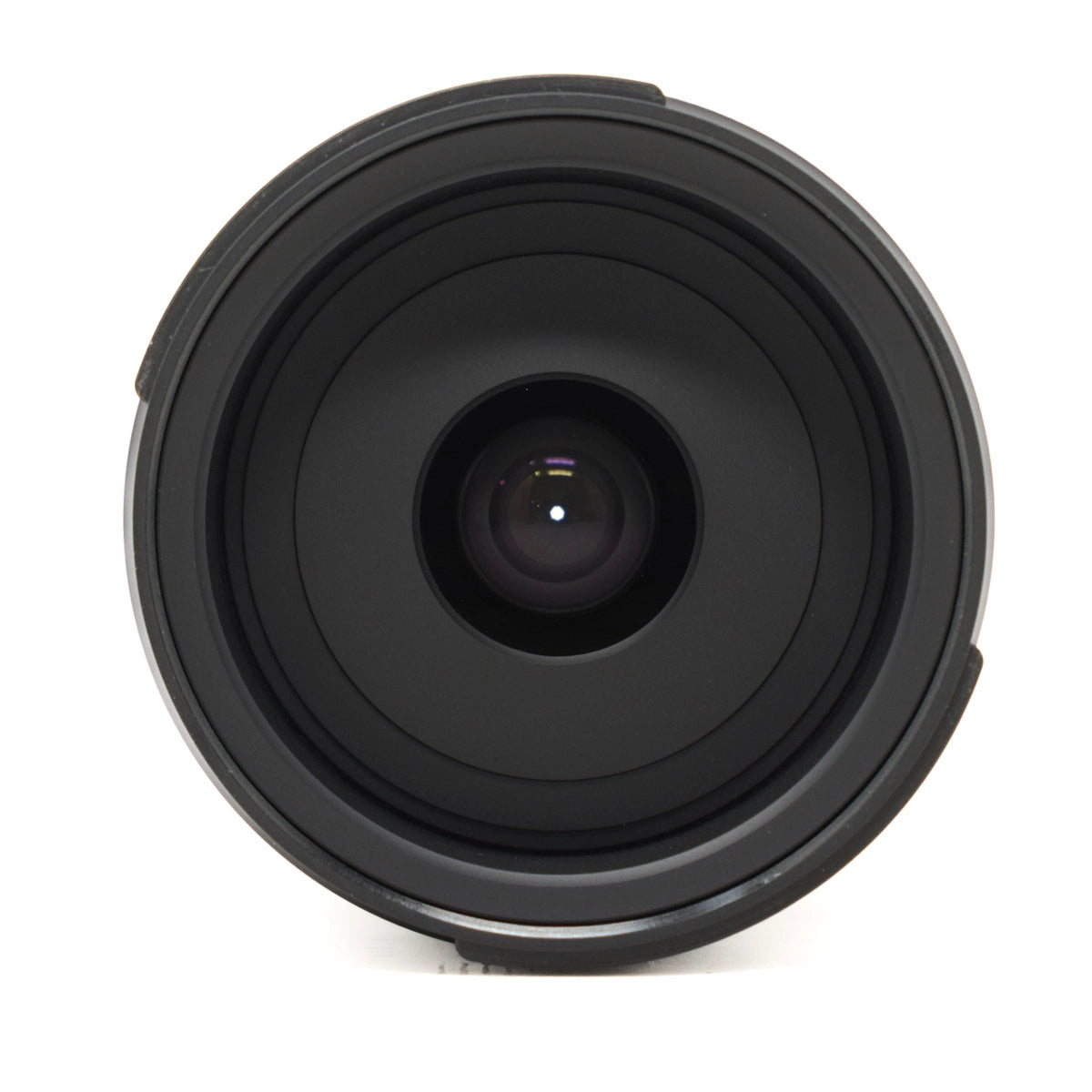 Black camera lens on a white background