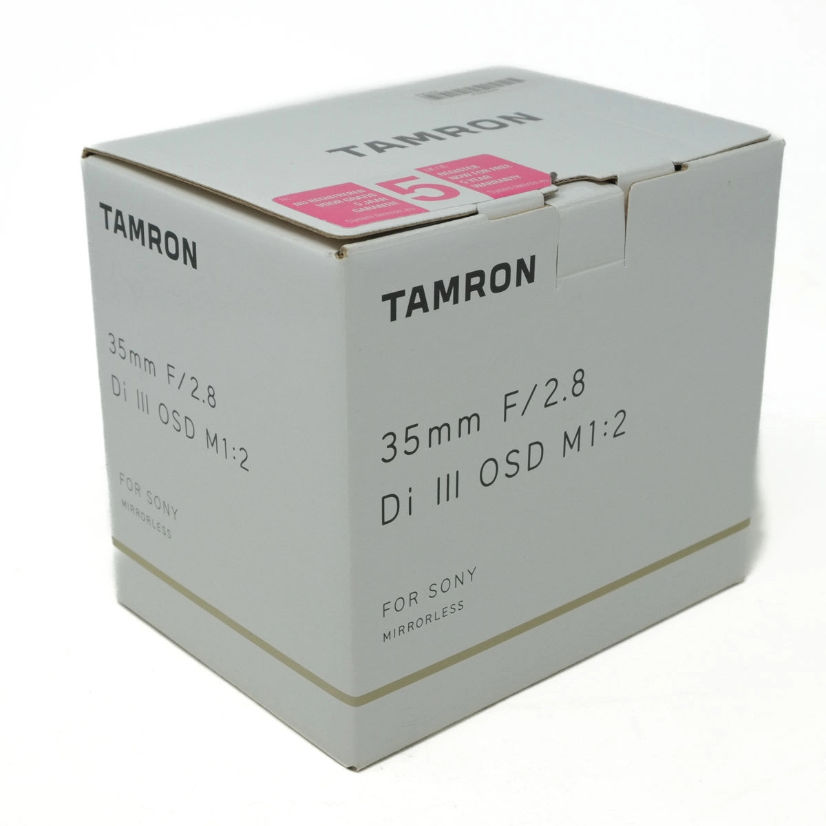 Tamron camera lens packaging box on a white background