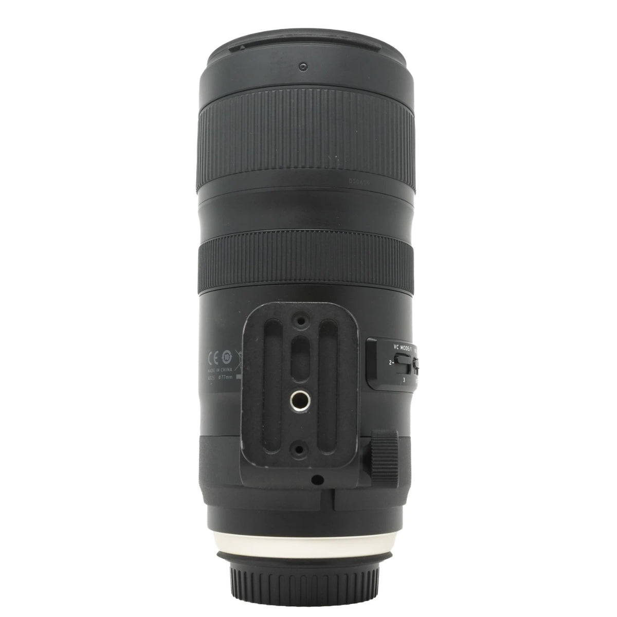 A black Tamron lens with a white ring at the front, shown from the back side against a plain white background.