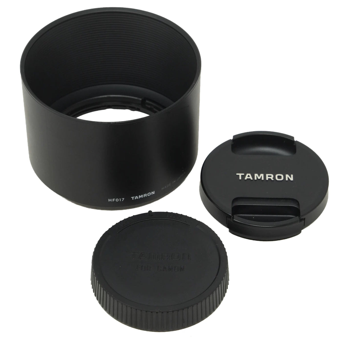 Tamron lens hood and lens cap components for a camera lens, shown on a clean white background.