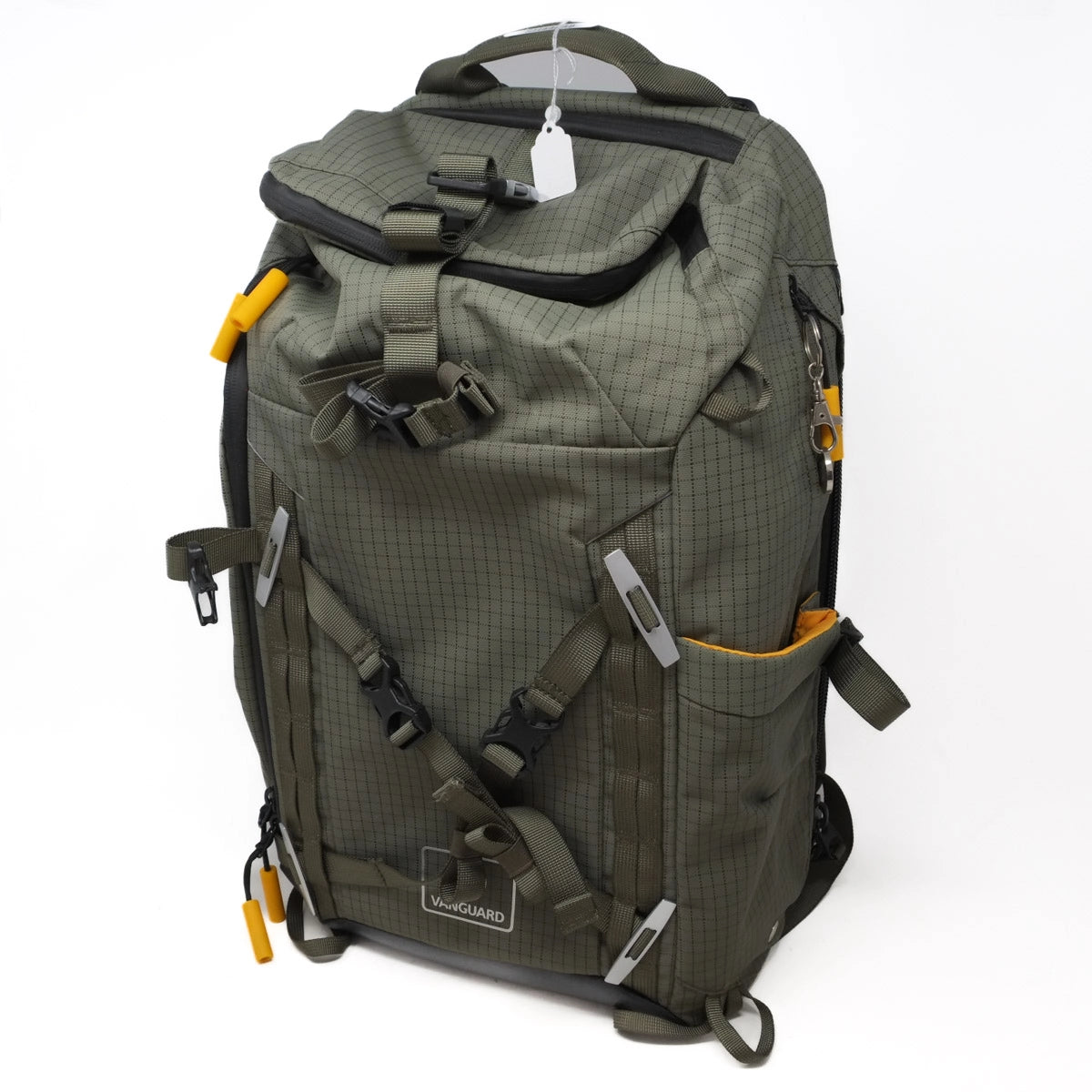 Green backpack with multiple straps and pockets on a white background