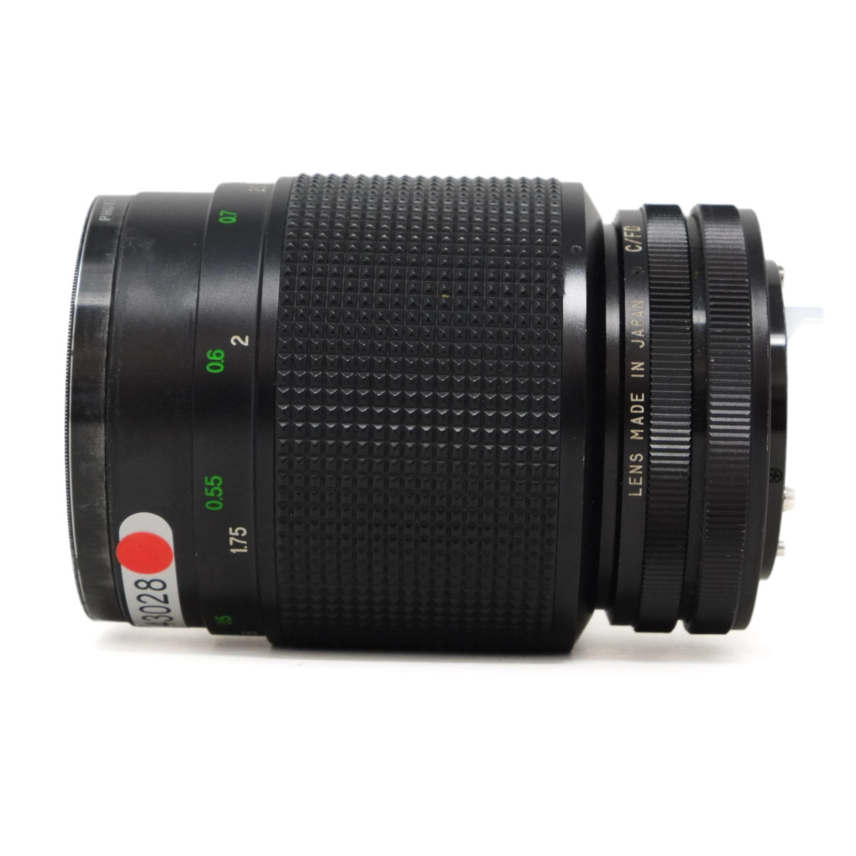 Camera lens with focus and aperture controls on a white background