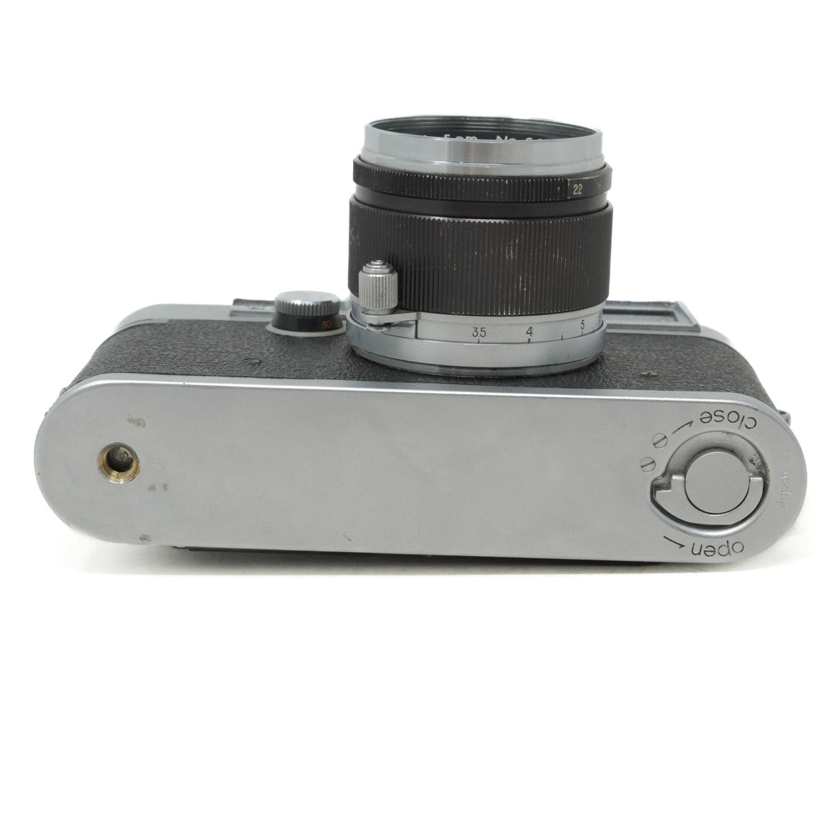 Vintage camera with lens on a white background