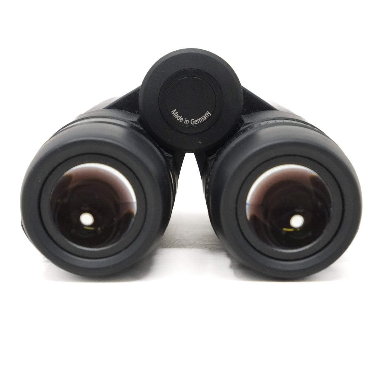 Black binoculars with 'Made in Germany' label on a white background