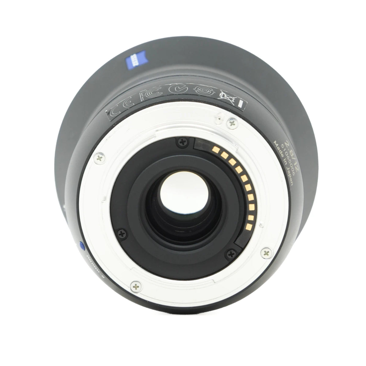 A Zeiss Carl Zeiss T* lens rear mount, showing the back side with the white metal ring, internal black elements, gold contact points, and blue brand accents on a white background.