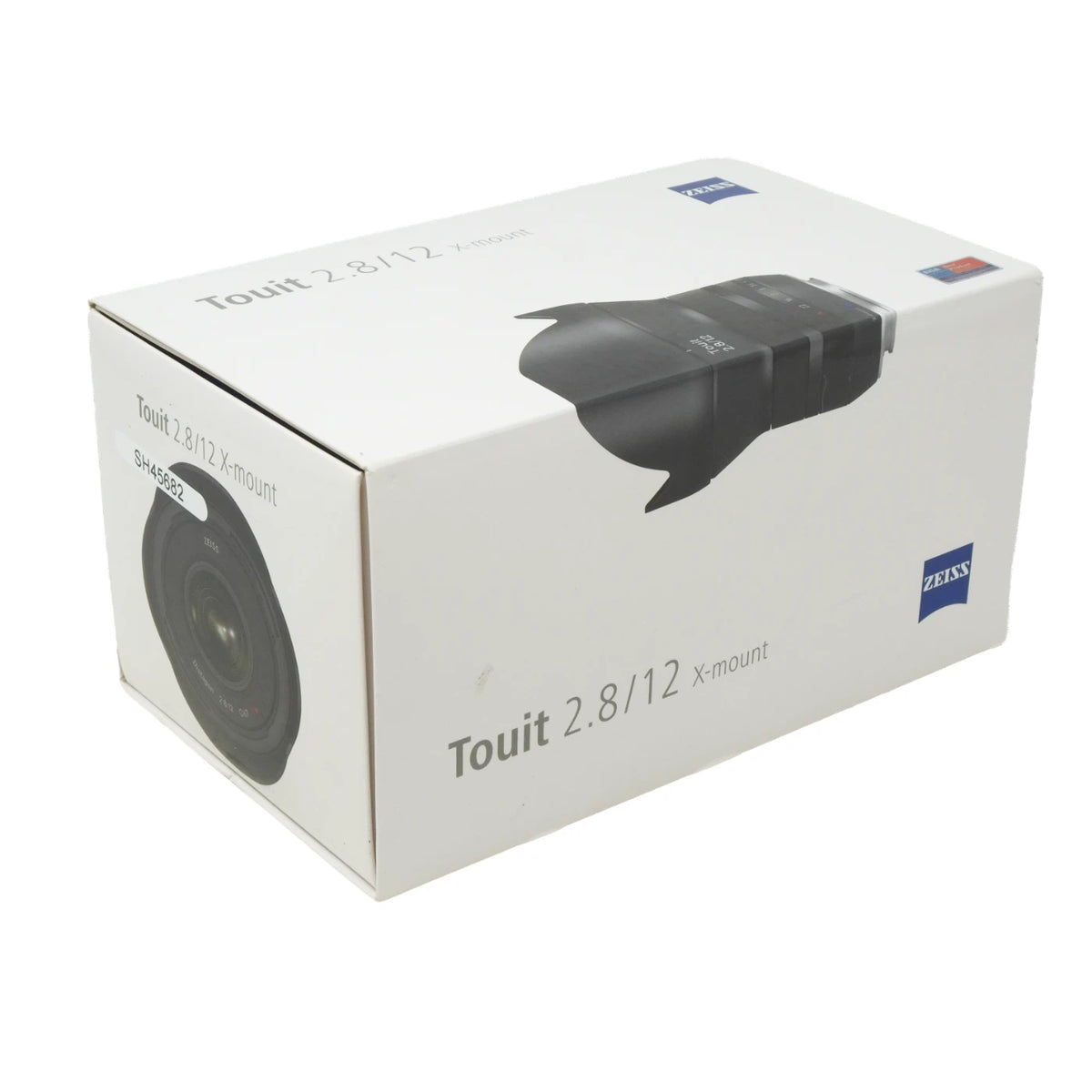 A white box for a Zeiss Touit 2.8/12 X-mount lens, showing printed images of the lens and the blue Zeiss logo on a clean white background.