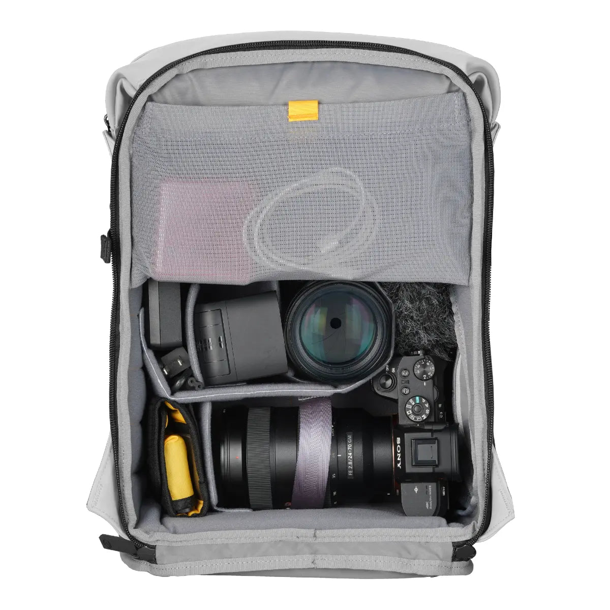 Camera bag with camera equipment inside on a white background