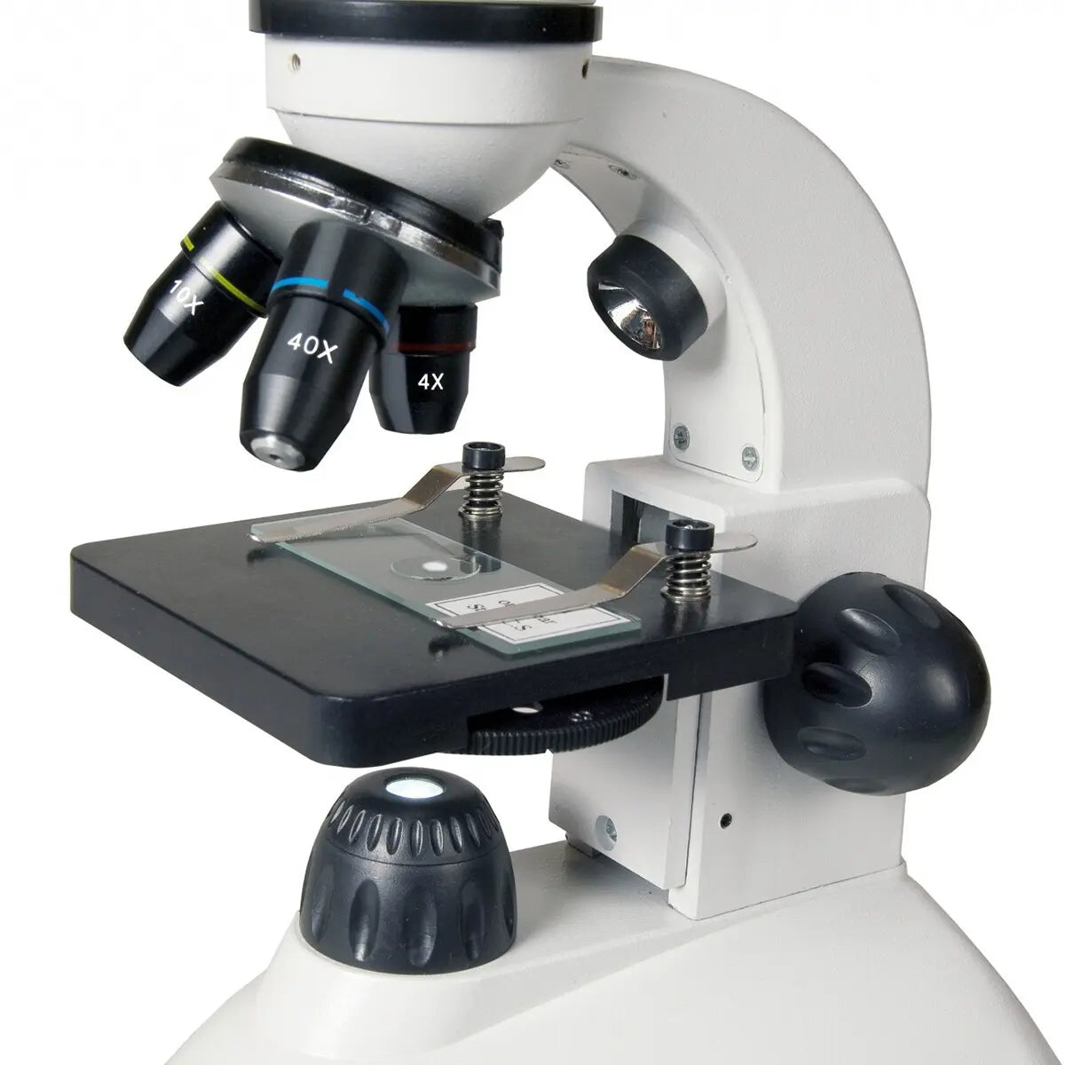 Microscope with various lens options on a white background