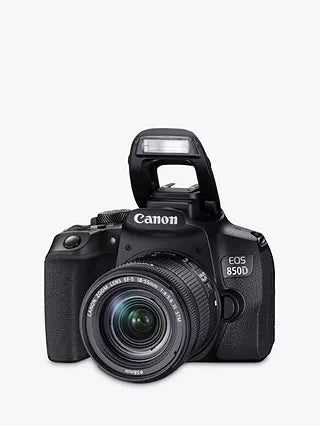 Front side view of the Canon EOS 850D Camera with the flash extended and lens attached