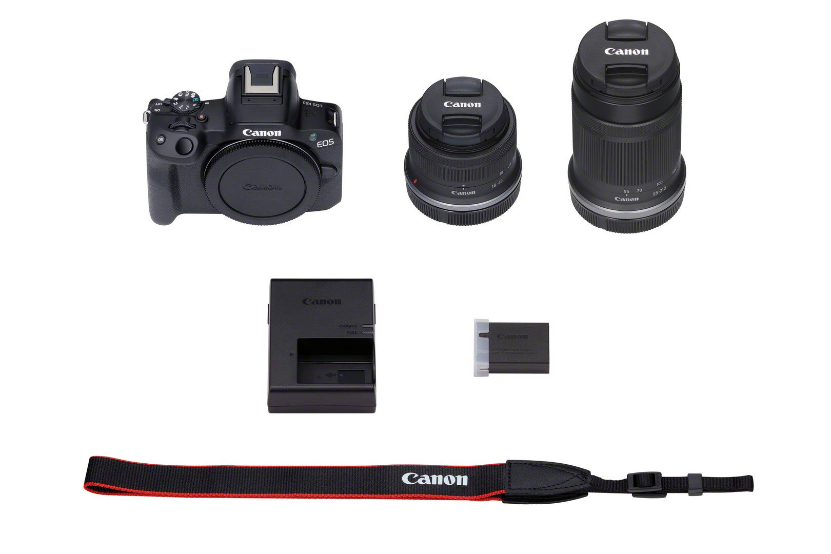 Canon EOS R50 Camera with RF-S 18-45mm & RF-S 55-210mm F5-7.1 IS STM Twin Lens Kit - Product Photo 3 - Top down perspective of the camera kit. Includes the camera, lenses, battery charger, battery and leash